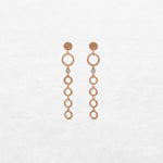 Circular earrings with different sizes with one diamond in rose gold made by O! Jewelry