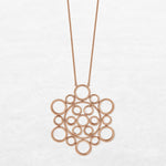 Necklace with different circular shapes in different sizes in rose gold made by O! Jewelry