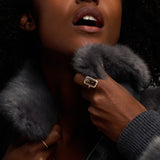 model with faux fur jacket wearing rectangular golden ring made by O! Jewelry