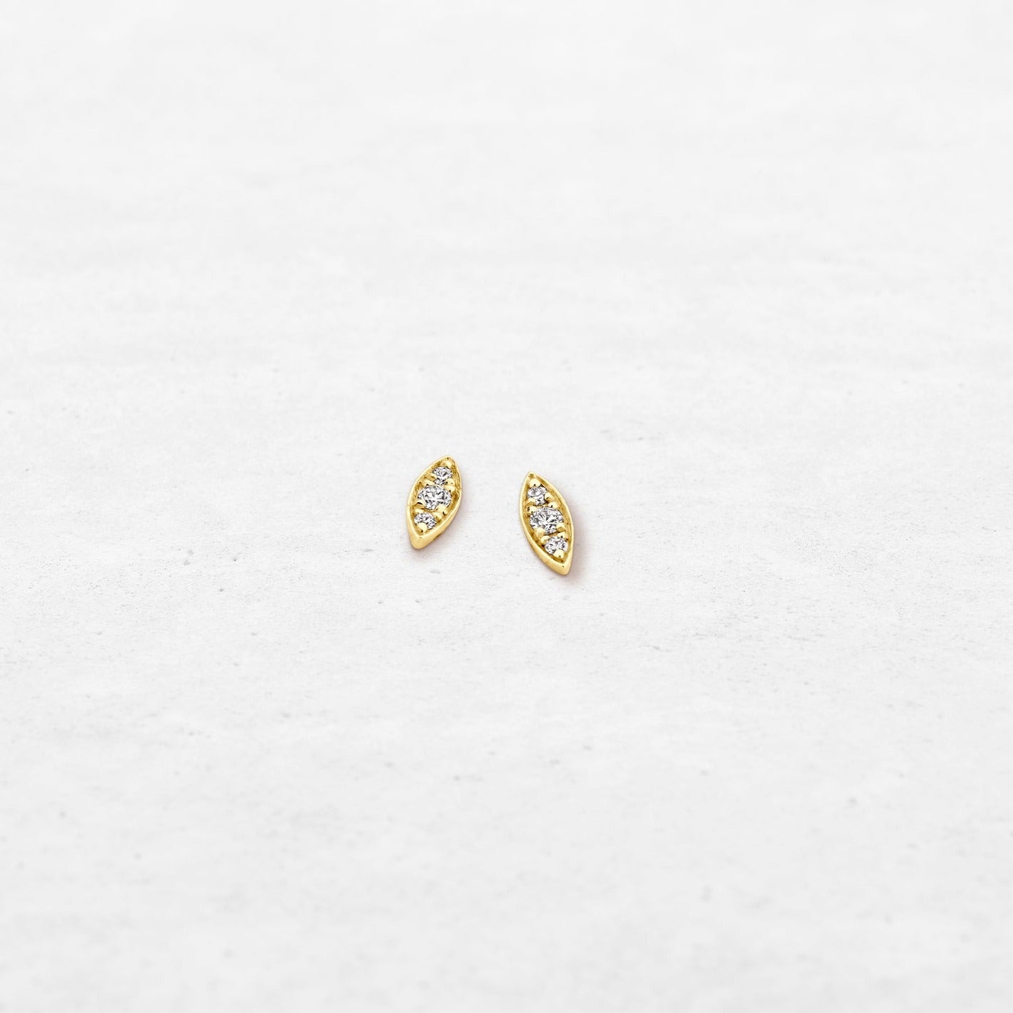 Single diamond leaf earring studs in yellow gold made by O! Jewelry