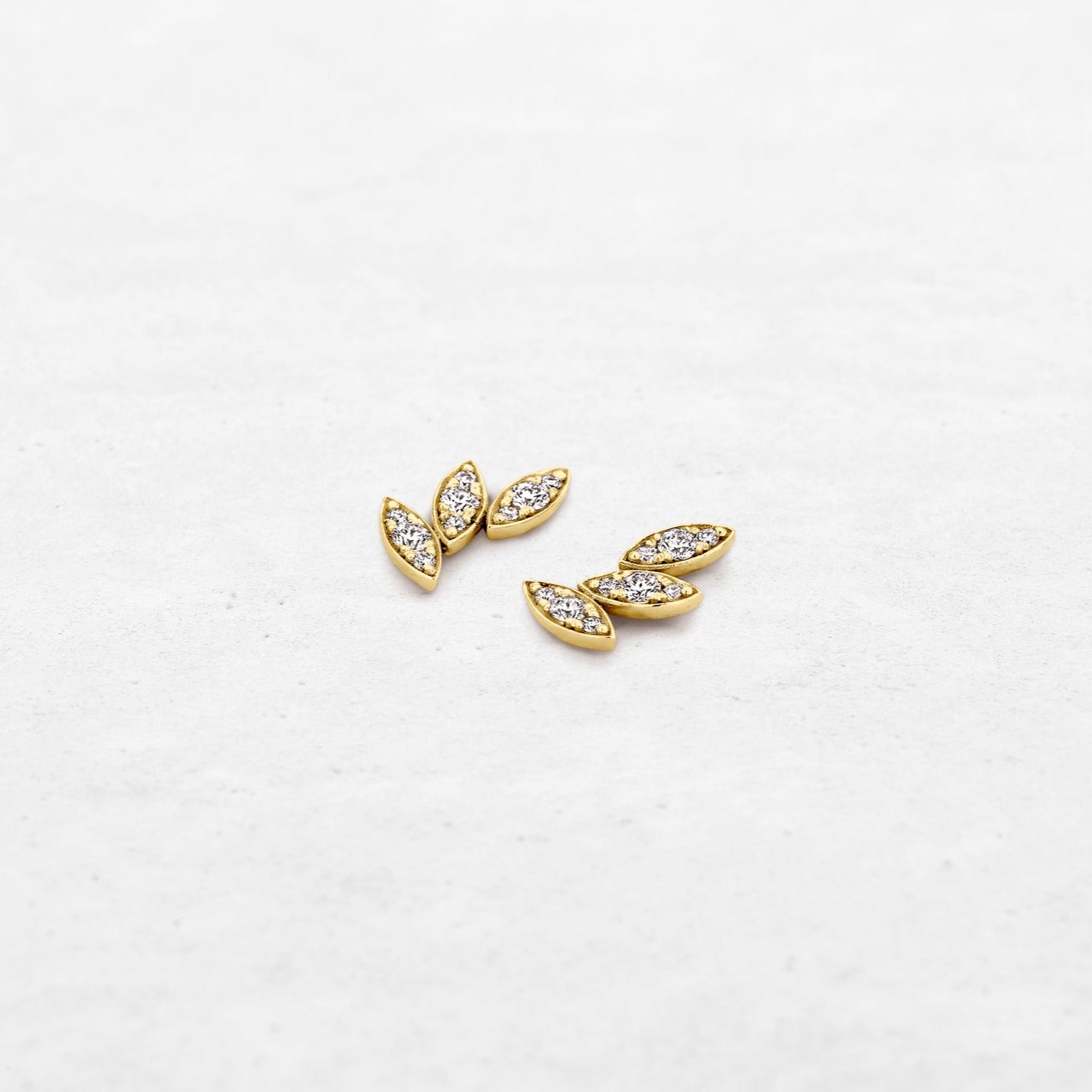 Diamond leaf earring studs in yellow gold made by O! Jewelry