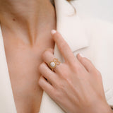 Circular ring with diamonds in central circle in rose gold on hand made by O! Jewelry
