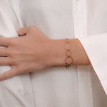 Bracelet around wrist of model made by O! Jewelry