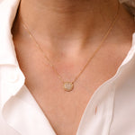 Necklace around neck with plateau set in diamonds by O! Jewelry